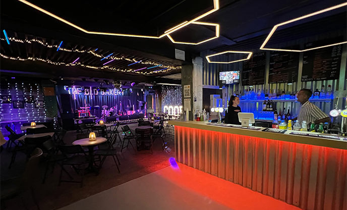 Inside of music venue with a bar and dance floor in Cornwall