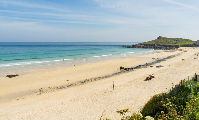 Porthmeor Beach in St Ives looking quiet in the autumn sunshine 