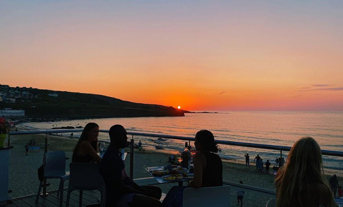 Sunsetting over beach café in St Ives Cornwall