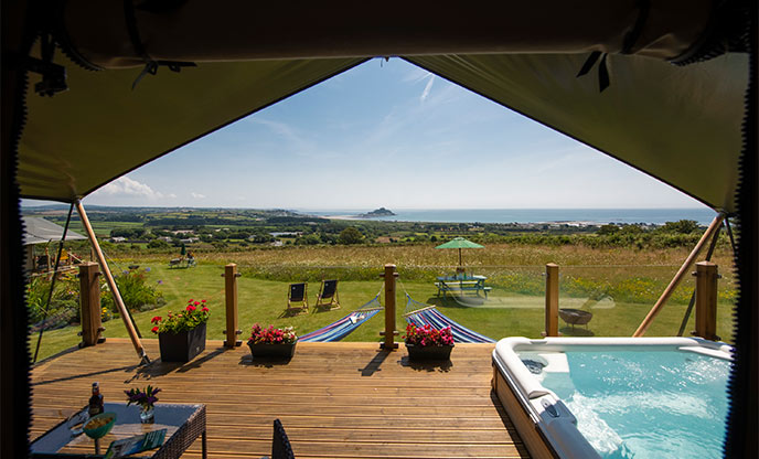 Safari tent with hot tub overlooking St Michaels Mount