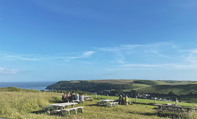 The stunning outside seating area at The Canteen at Maker Heights with the beautiful view over Rame Peninsula in the background