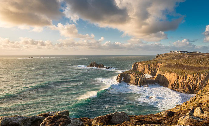 A view of the coastline at Land's End, looking out to see at golden hour.
