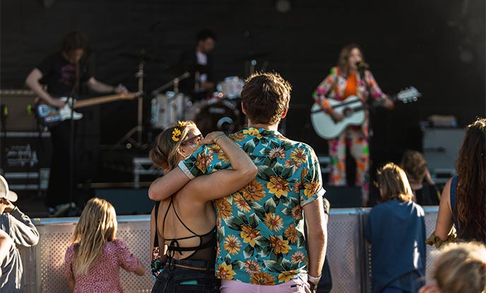 Two people enjoying a music festival in Cornwall