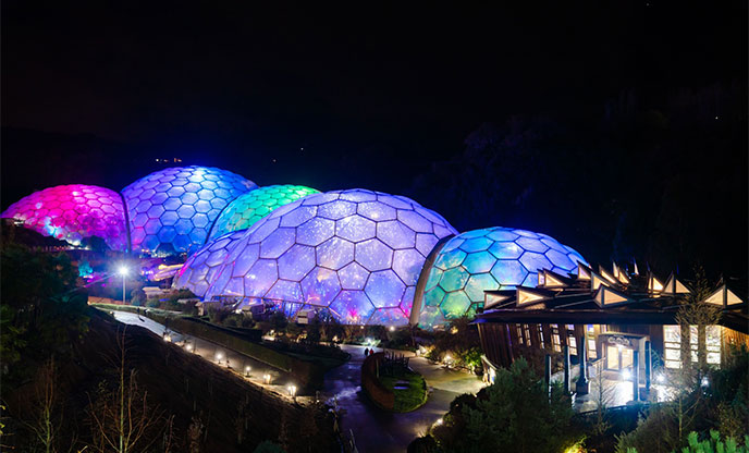 Biomes glowing at night at The Eden Project, Cornwall
