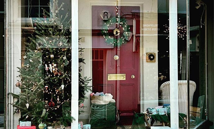 Festive shop window with Christmas tree and decorations