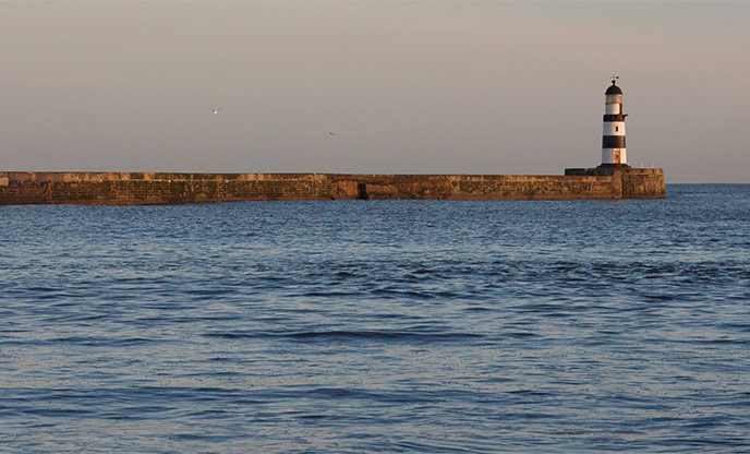 The harbour walls and lighthouse at Seaham Harbour in County Durham