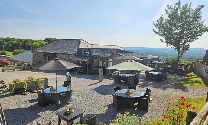 Looking out over Ullacombe Farm shop, where outside tables enjoy views over Dartmoor