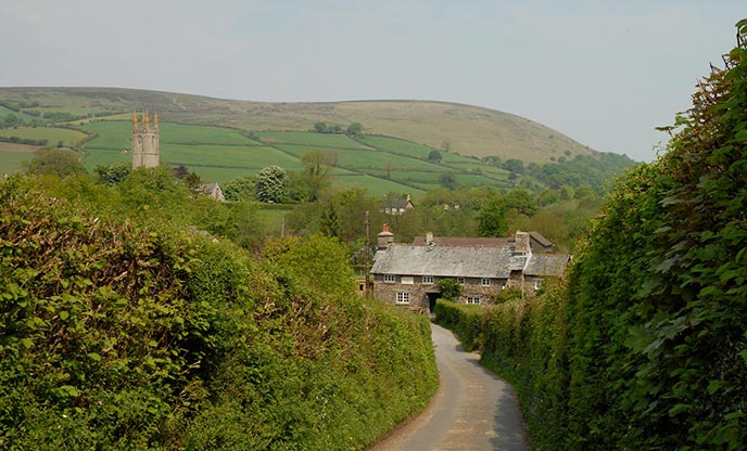 A country lane leads the way down to the traditional Rugglestone Inn