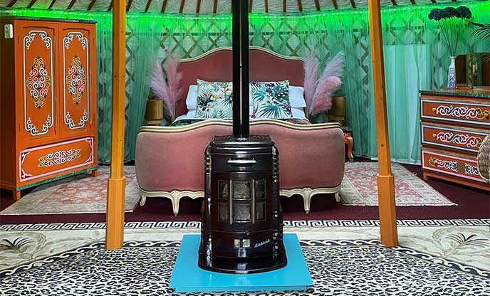 Inside bohemian yurt with tropical décor