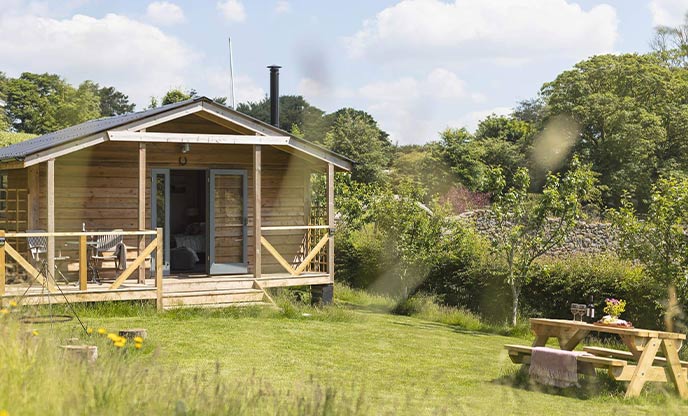 The pretty shepherd's hut and garden at Room With A View in Dartmoor