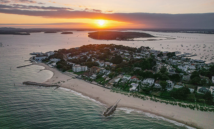 An aerial view of Sandbanks in Dorset at sunset