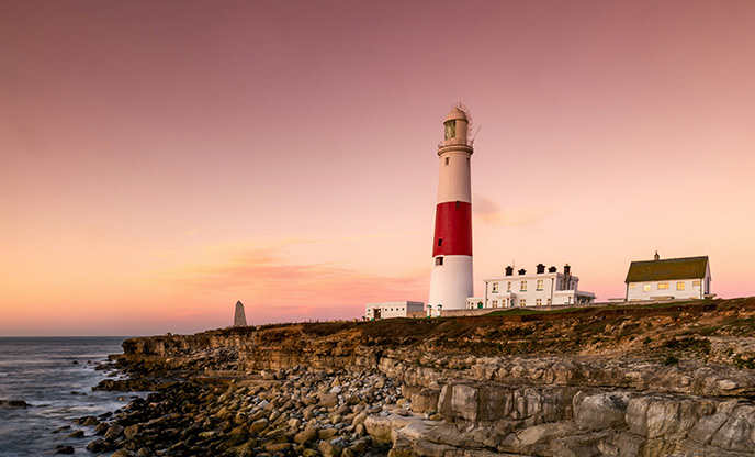 A view of Portland Bill lighthouse in Dorset at sunset