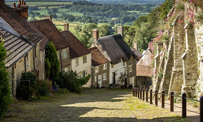A view down Gold Hill in Dorset, a steep street lined with old cottages