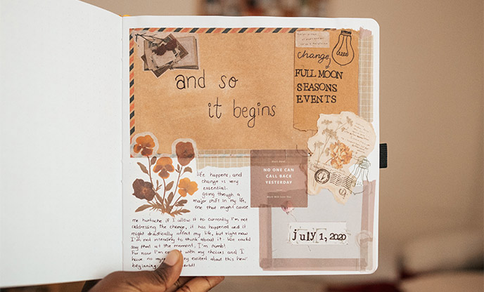 A scrapbook journal with stickers, writing and flowers