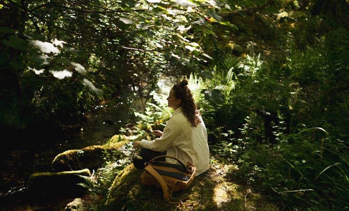 Someone meditating in a forest