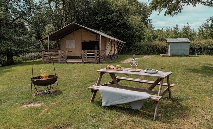 River Safari in Herefordshire with picnic bench and firepit in the foreground