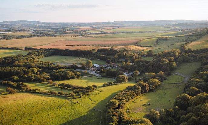 Birdseye view of the Garlic Restaurant, nestled in the rolling hills of Newchurch as the sun begins to set