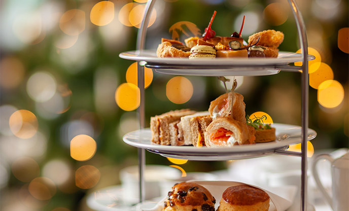 A luxurious afternoon tea at The Royal with fairy lights glistening in the background