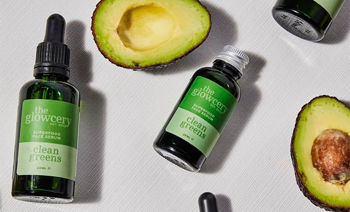 The Glowcery green cleans skin care range displayed with avocados 