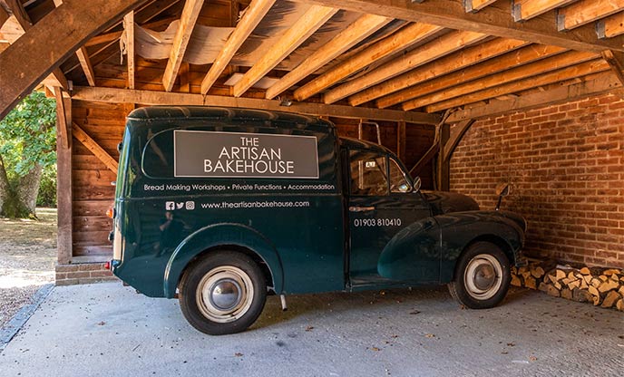 Vintage mini van advertising the artisan bakehouse