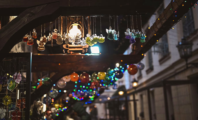 Christmas baubles glistening under the market stall lights