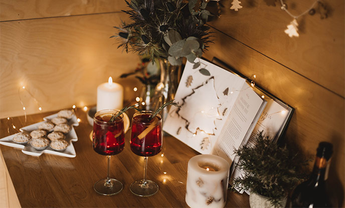 Christmas cocktails surrounded by pretty fairy lights