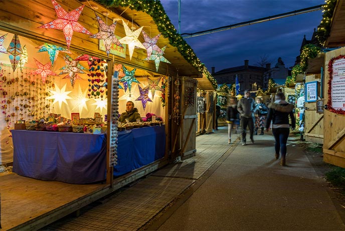 A Christmas market stall displaying handcrafted star decorations