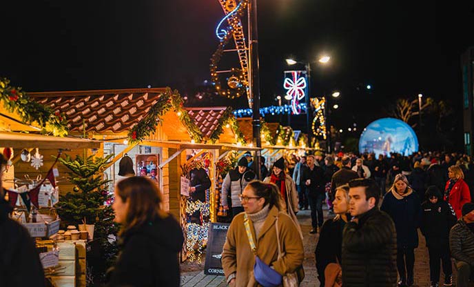 People exploring the market stalls in Truro