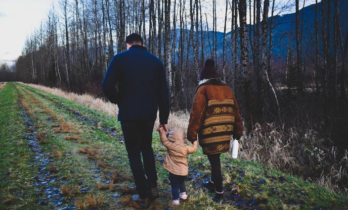 Family walking in the forest at Christmas 