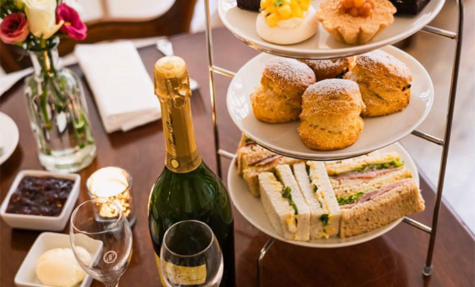 Afternoon tea with sandwiches, scones, cakes and champagne at The Castle Hotel, Taunton