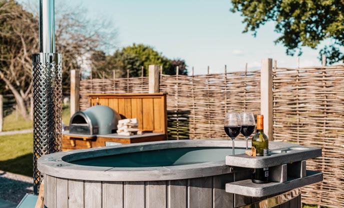 The wood-fired pizza oven and hot tub at The Crook in Somerset