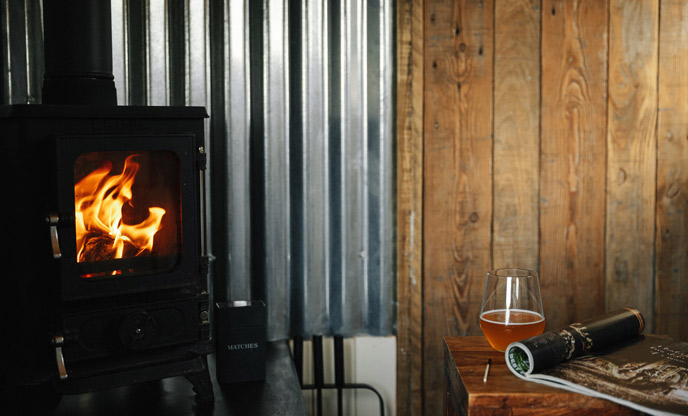 Flickering wood-burner (left) drink and magazine (right)