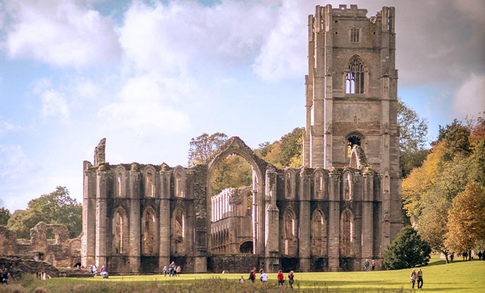 The historic ruins of Fountains Abbey in autumn in Yorkshire