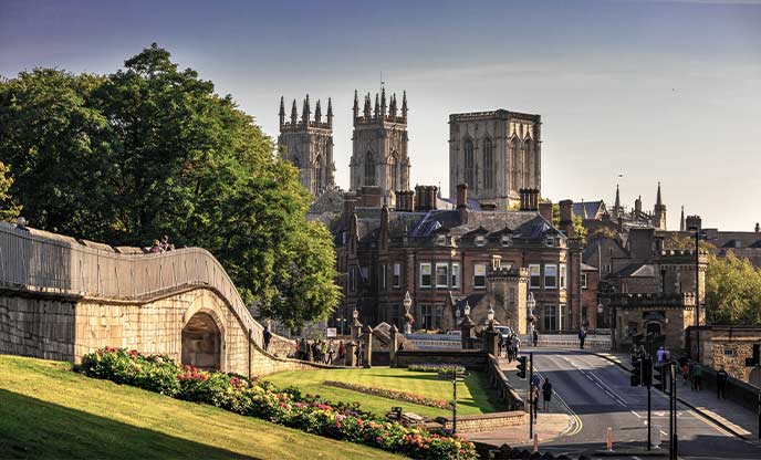 Looking across historic buildings of York Minster with the cathedral in the background